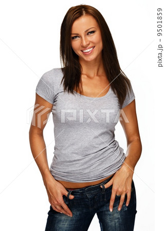 Young positive brunette girl with long hair wearing t-shirt and jeans Young positive brunette girl with long hair wearing t-shirt and jeans 9501859