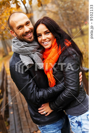 Happy middle-aged couple outdoors on beautiful autumn day 9502133