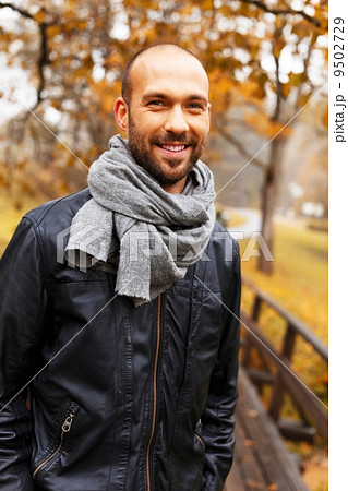 Positive middle-aged man alone on beautiful autumn day 9502729