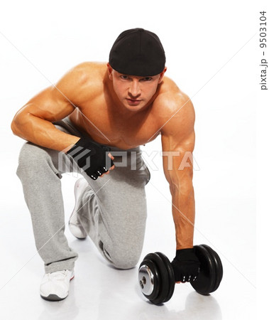 Handsome young muscular man exercising with dumbbells 9503104