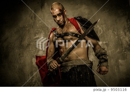 Wounded gladiator with sword covered in blood Wounded gladiator with sword covered in blood 9503116