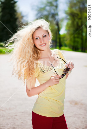 Cheerful blonde with sunglasses Cheerful blonde with sunglasses 9506418