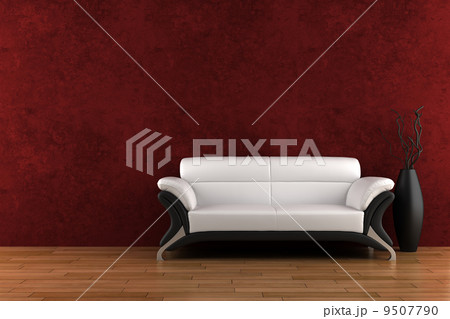 white sofa and vase with dry wood in front of red wall 9507790