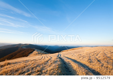 Sunrise autumn mountain road view. 9512579