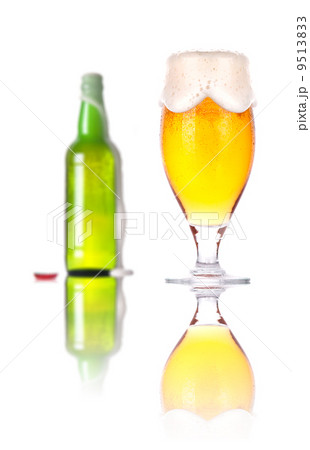 Frosty glass and bottle of beer isolated Frosty glass and bottle of beer isolated 9513833