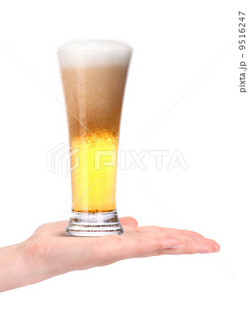 hand offering glass of beer in ice isolated hand offering glass of beer in ice isolated 9516247