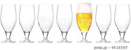 empty and one full beer glass isolated 9516597