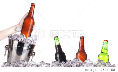 frosty beer with ice bucket and hand frosty beer with ice bucket and hand 9521168