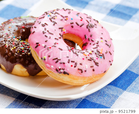 Fresh donuts on nature background Fresh donuts on nature background 9521799