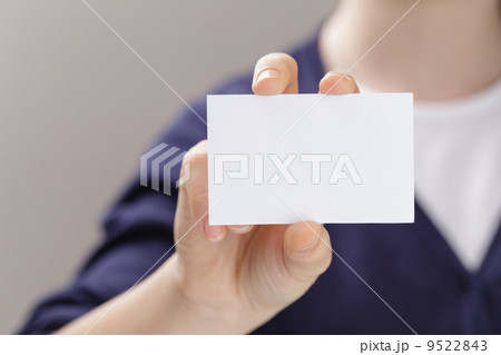 female teen holding empty business card in front of camera female teen holding empty business card in front of camera 9522843