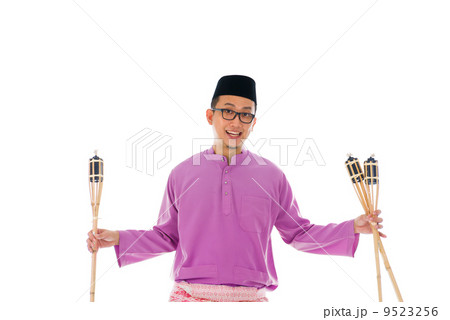 Malay man celebrating hari raya the month after ramadan 9523256