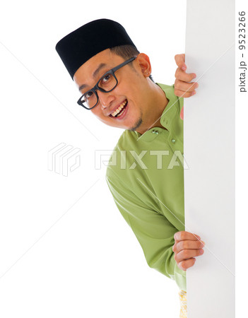 malay male with blank card during hari raya Eid al-Fitr aidilfit malay male with blank card during hari raya Eid al-Fitr aidilfit 9523266