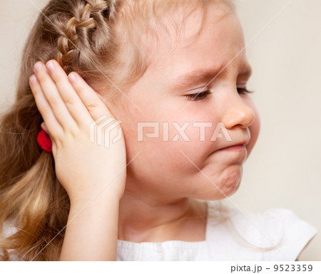 Girl has a sore ear Girl has a sore ear 9523359