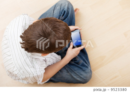 Child with smart phone Child with smart phone 9523380