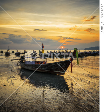 Traditional thai boats at sunset beach. Ao Nang, Krabi province 9524217