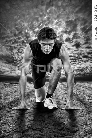 Creative photo of athletes at the start. Black and white. 9524581