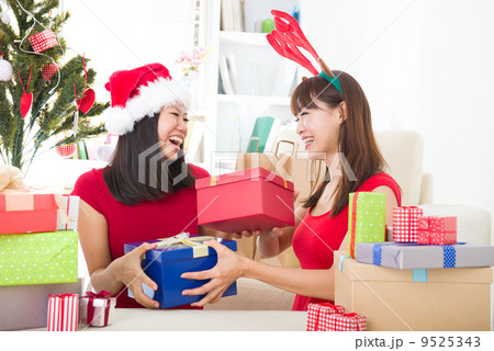 asian friends christmas celebration , chinese south east asian e 9525343