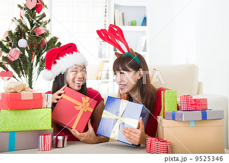 chinese girl friends during a christmas celebration 9525346