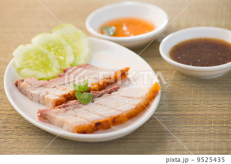Siu Yuk - Chinese roasted pork served with soy and hoisin sauce. Siu Yuk - Chinese roasted pork served with soy and hoisin sauce. 9525435
