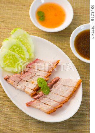chinese roast pork close up shot served with chilli sauce chinese roast pork close up shot served with chilli sauce 9525436