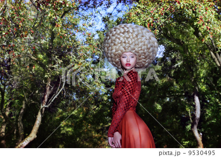 Fashion Style. Creativity. Eccentric Woman in Art Wig with Braids Fashion Style. Creativity. Eccentric Woman in Art Wig with Braids 9530495