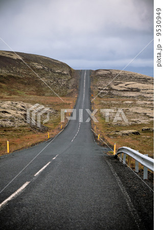 Highway through Iceland landscape at overcast day 9530949