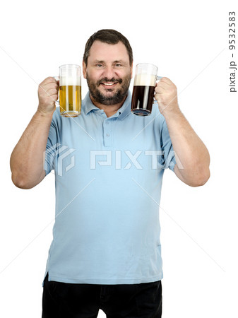 Bearded man raised two mugs of beer Bearded man raised two mugs of beer 9532583
