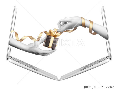 hand with a gift and laptop 9532767