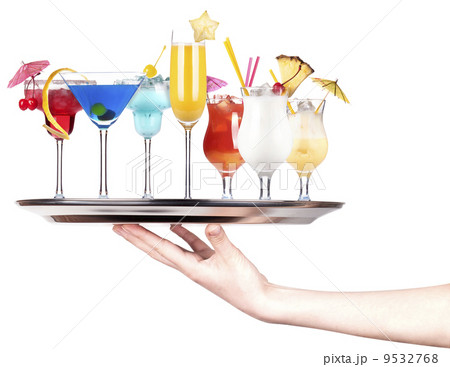 hand with alcohol cocktail on a silver tray 9532768
