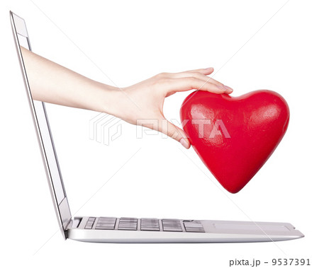 hand with a heart - gift and laptop hand with a heart - gift and laptop 9537391