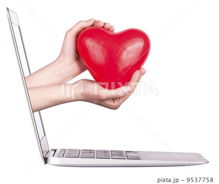 hand with a heart - gift and laptop 9537758