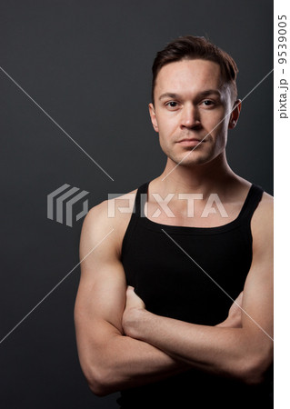 Young man with crossing arms Young man with crossing arms 9539005