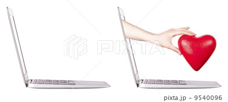 hand with a heart - gift and laptop hand with a heart - gift and laptop 9540096