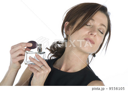 sensual woman applying perfume on her body 9556105