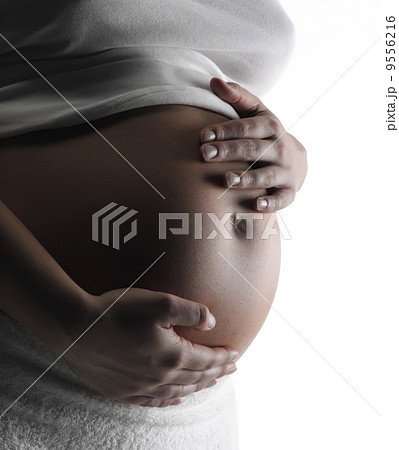 Image of pregnant woman touching her belly with hands Image of pregnant woman touching her belly with hands 9556216
