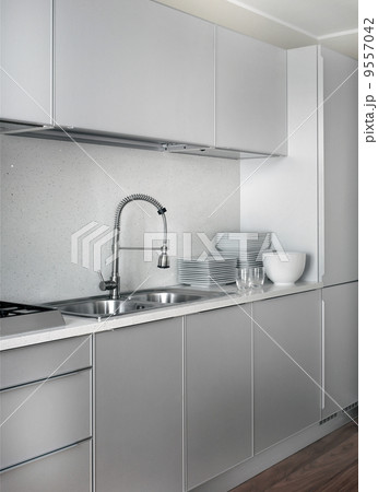 nterior of big white kitchen in apartment 9557042