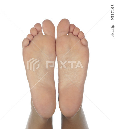 Female feet on a white background 9557198
