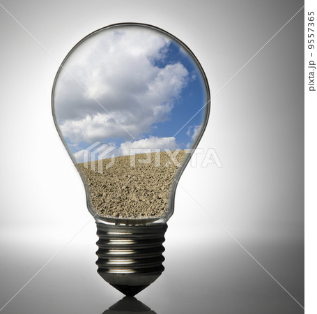 Clean energy, a light bulb with a bright sky 9557365
