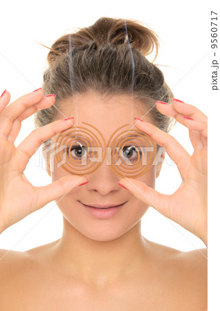 Young woman holds spiral aromas 9560717