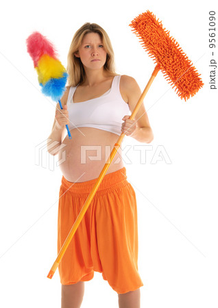 angry pregnant woman with a mop 9561090