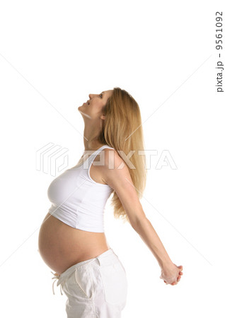 Pregnant woman practicing yoga Pregnant woman practicing yoga 9561092