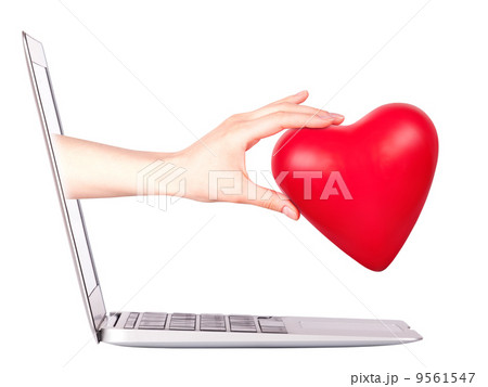hand with a heart - gift and laptop 9561547