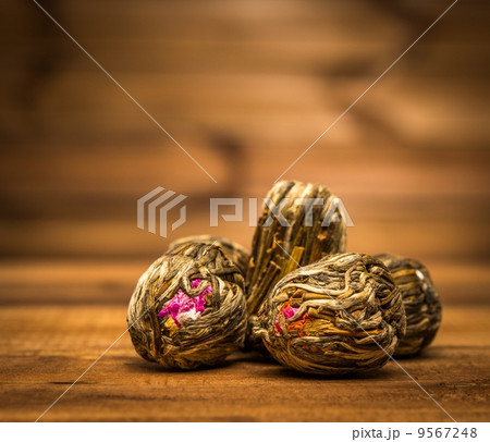 Flower tea close-up over wooden background Flower tea close-up over wooden background 9567248