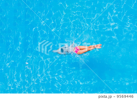 Top view of a girl diving in the pool 9569446