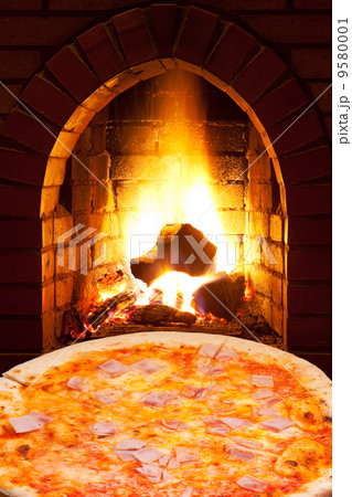 pizza with ham and open fire in oven pizza with ham and open fire in oven 9580001
