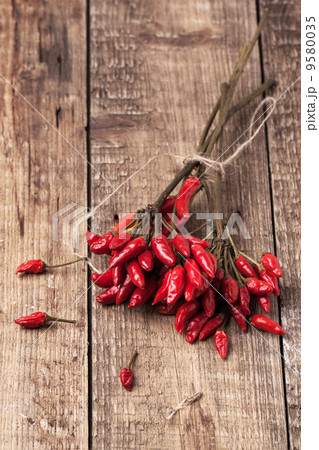 Red hot chili peppers over wooden background 9580035