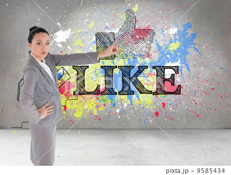 Composite image of unsmiling asian businesswoman pointing Composite image of unsmiling asian businesswoman pointing 9585434