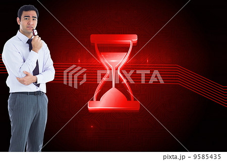 Composite image of thinking businessman holding glasses Composite image of thinking businessman holding glasses 9585435