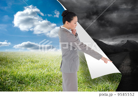 Composite image of thoughtful asian businesswoman pointing Composite image of thoughtful asian businesswoman pointing 9585552