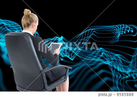 Composite image of businesswoman sitting on swivel chair with ta Composite image of businesswoman sitting on swivel chair with ta 9585888